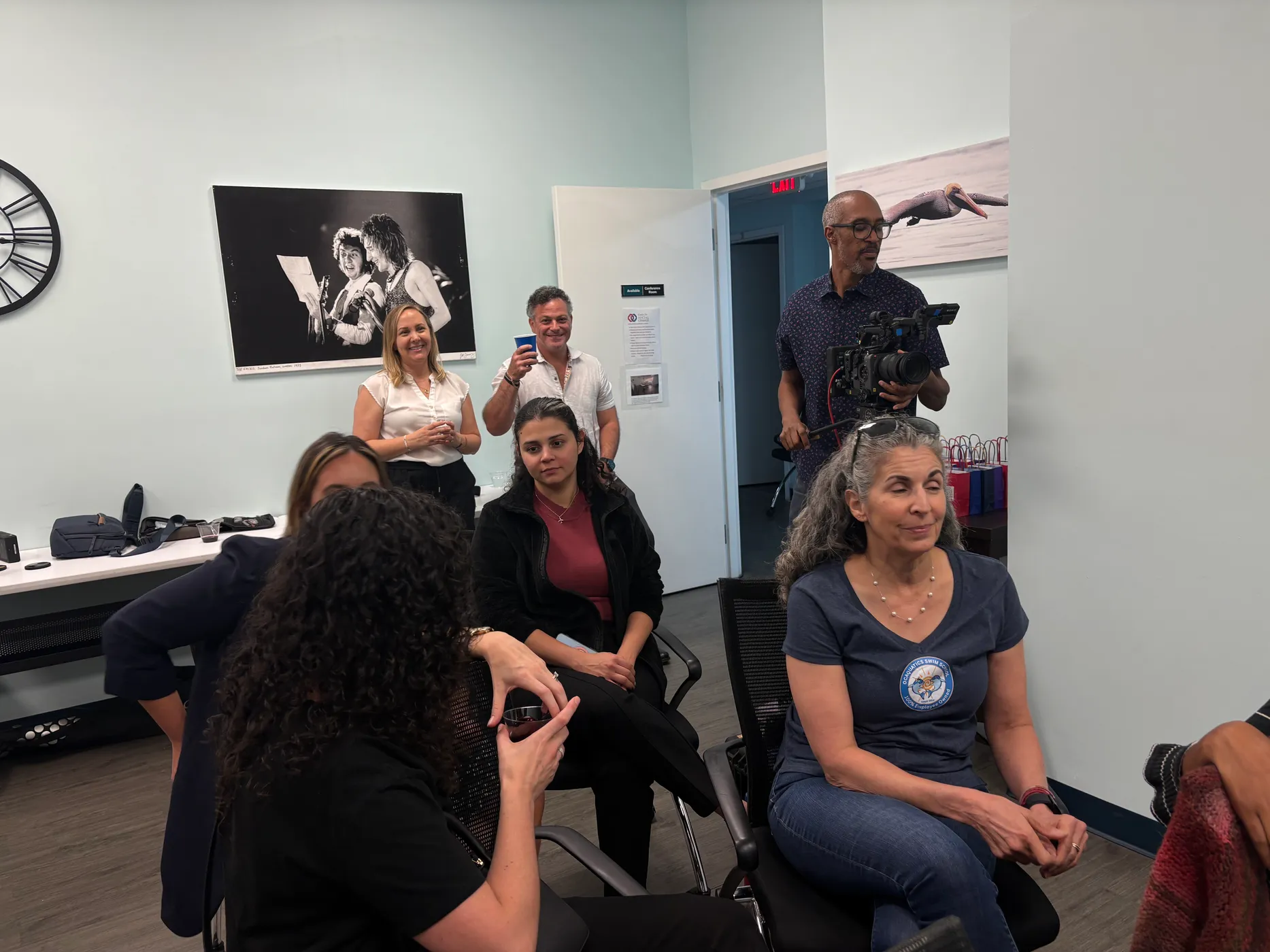 A RiseWorks creator filming a community storytelling event